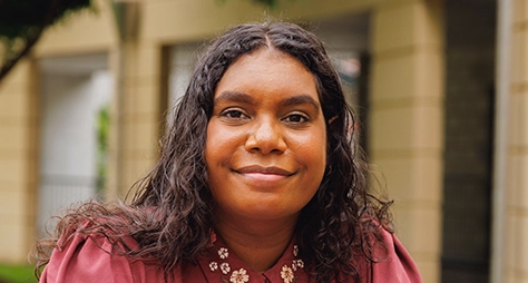 Aboriginal university student smiling at the camera